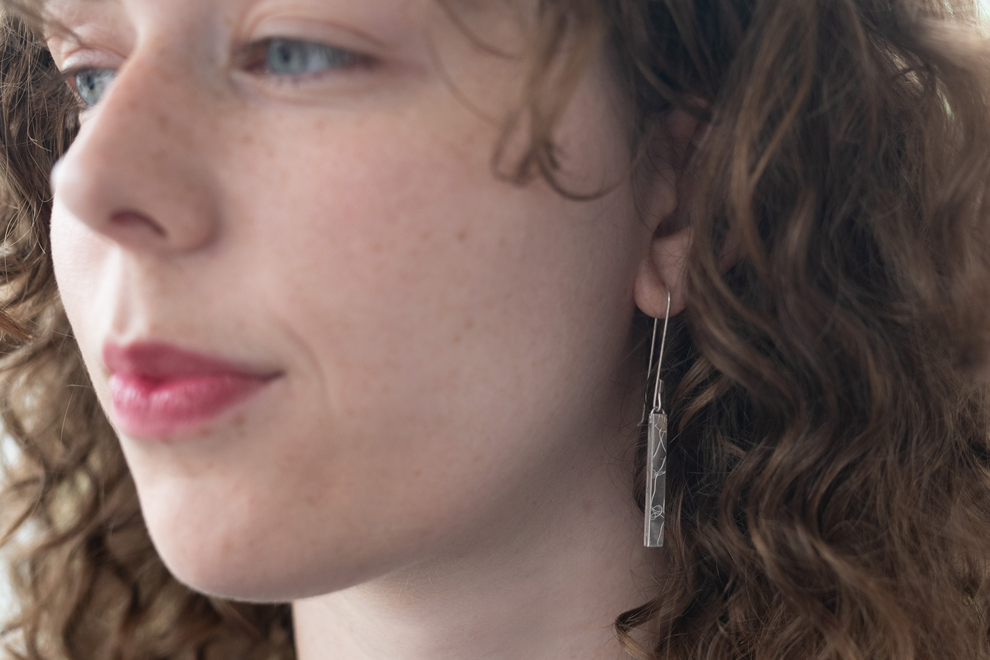 Long strut hook earrings