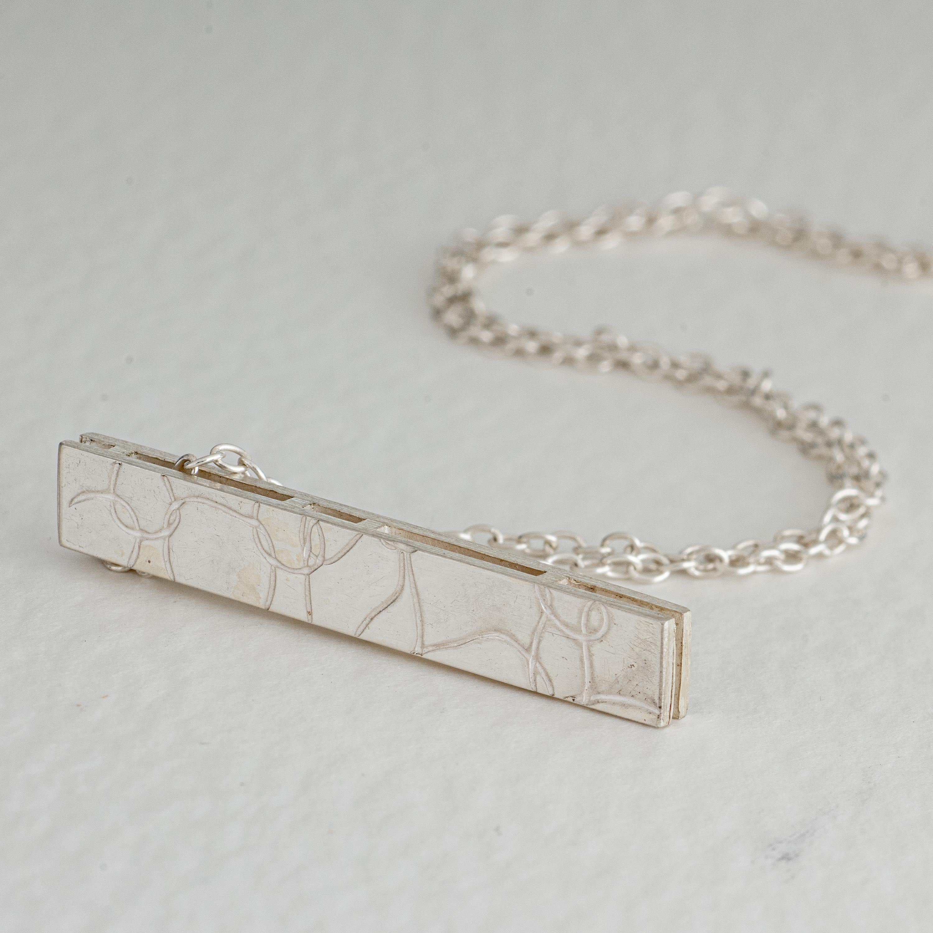 Silver strut pendant